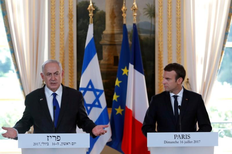 French President Emmanuel Macron and Israeli Prime Minister Benjamin Netanyahu attend a news conference to make a joint declaration at the Elysee Palace in Paris