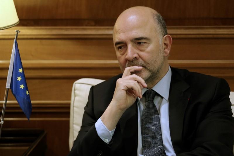 European Economic and Financial Affairs Commissioner Pierre Moscovici meets with Greek Prime Minister Alexis Tsipras (not pictured) at the Maximos Mansion in Athens, Greece